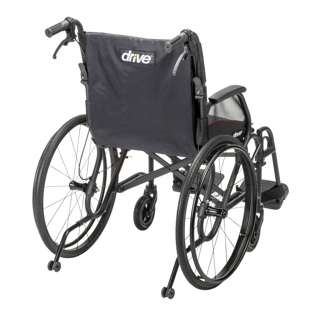 Rear angle of the black AeroFly wheelchair showing the Drive-branded backrest, push handles, rear wheels, and anti-tippers.