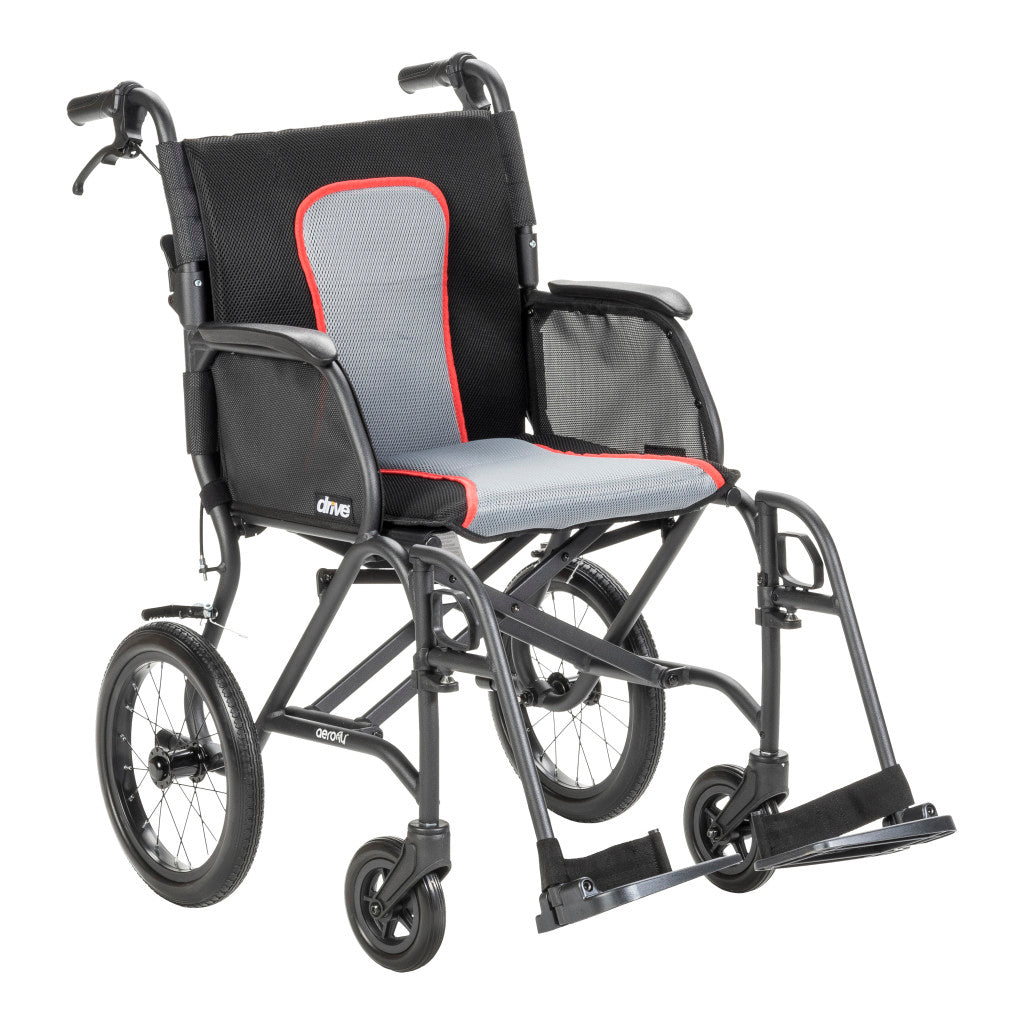 Front angled view of the black AeroFly transport wheelchair featuring gray upholstery with red trim, padded armrests, and footrests.
