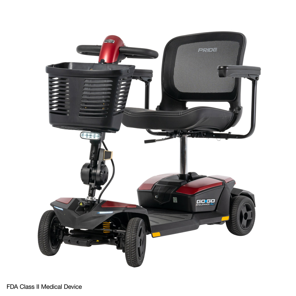 Front angle view of the Go Go Endurance AL+ travel scooter with red body panels, mesh-back seat, front basket, and enhanced ride comfort.