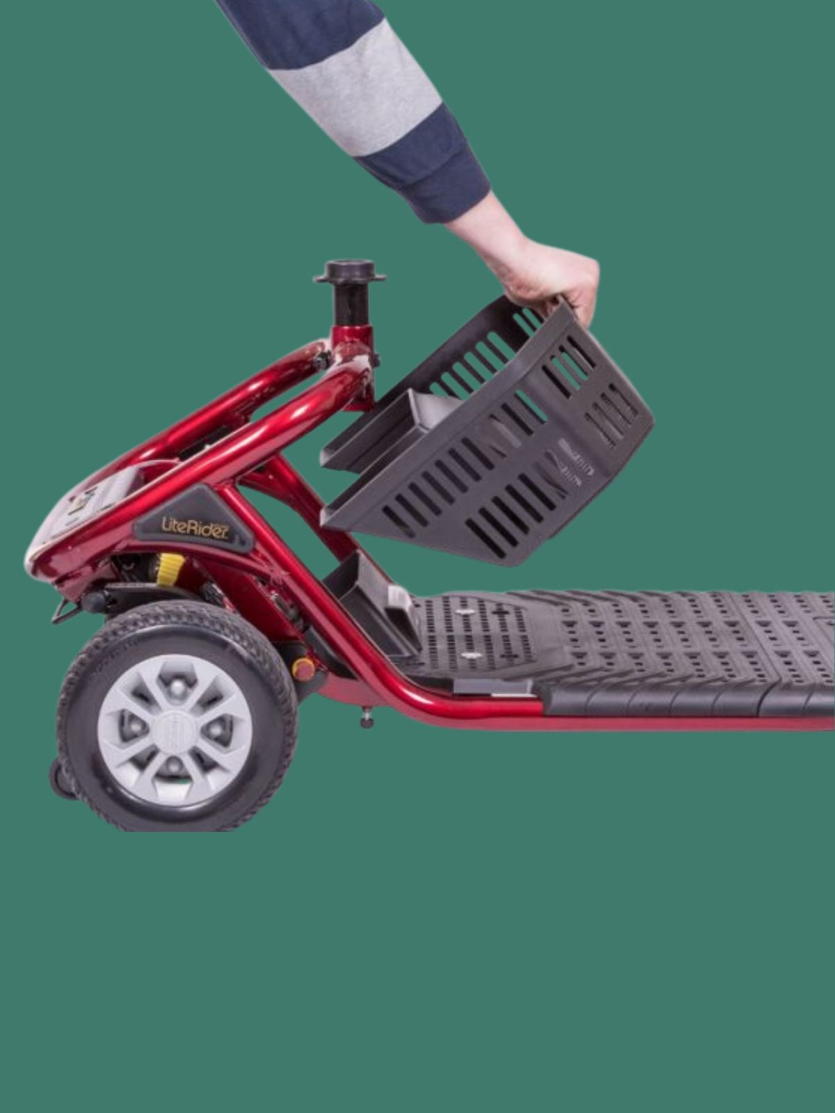 Removable under-seat storage basket being lifted from the Golden LiteRider scooter for convenient access and transportation.