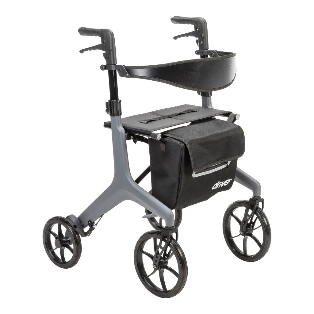 Grey AeroCarbon carbon fiber rollator shown at an angle with hand brakes, a seat, curved black backrest, storage bag, and four wheels.