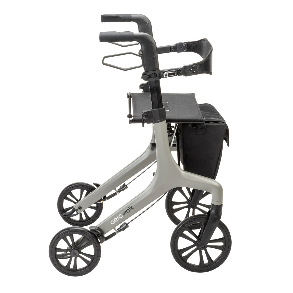 Side view of the grey AeroWalk rollator highlighting its handles, brake levers, seat, storage bag, and four-wheel design.