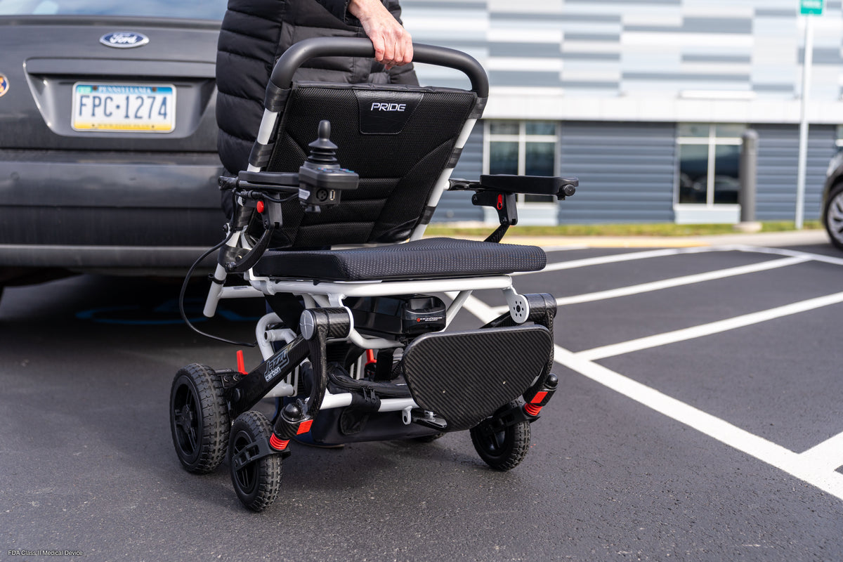Pride Jazzy Carbon portable folding power wheelchair ready for travel.