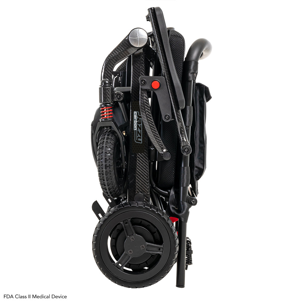 Folded Pride Jazzy Carbon power wheelchair shown from the side for compact storage.