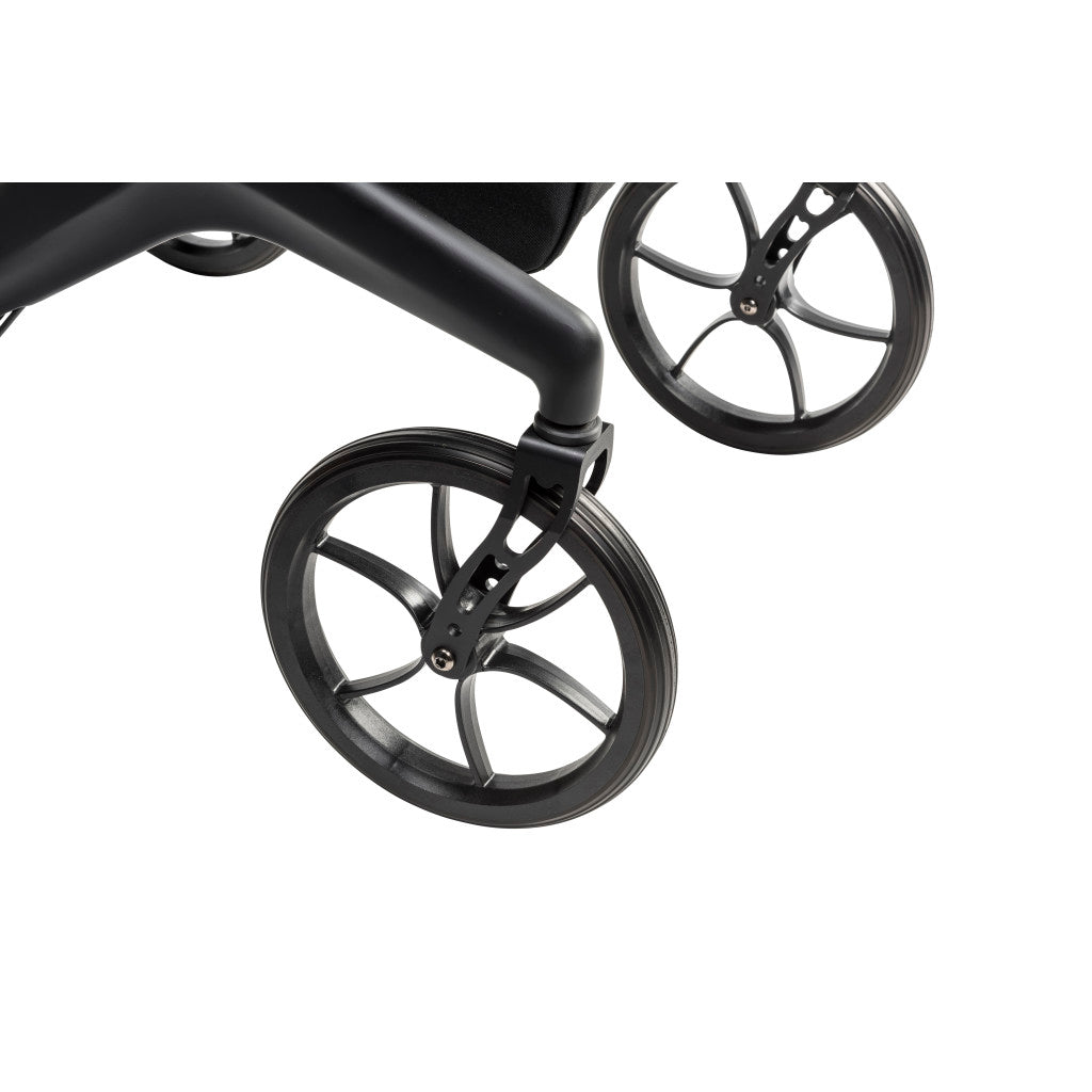 Close-up of the black AeroCarbon rollator’s front wheel, wheel fork, and carbon fiber frame.