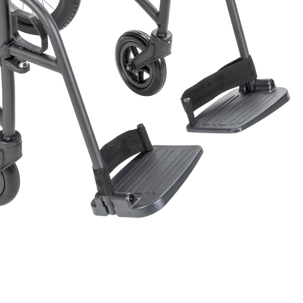 Close-up of the AeroFly transport wheelchair’s two textured footplates, footrest supports, and front caster.