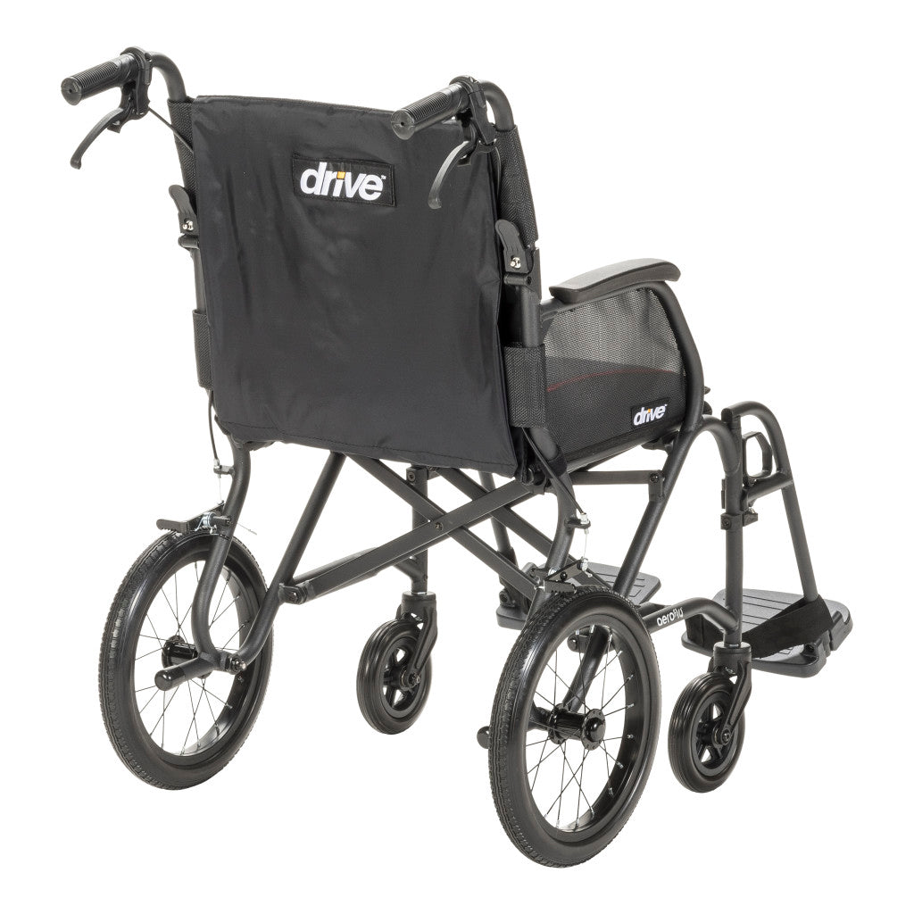 Rear angled view of the AeroFly transport wheelchair showing its black backrest, caregiver handles, and cross-brace frame.