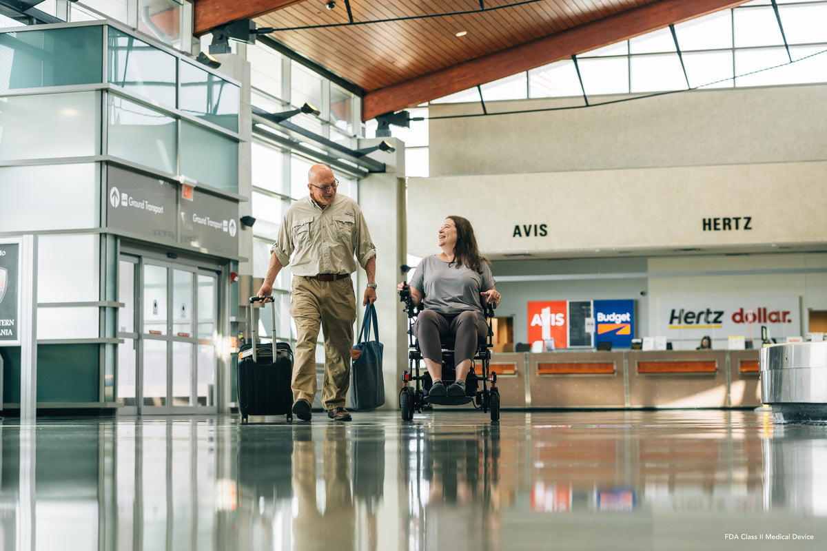 Traveler using the Pride Jazzy Carbon for convenient airport mobility.