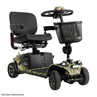 Angled front view of the Baja Bandit mobility scooter in Sage Tan Camo, showing its illuminated headlight, front basket, padded seat, armrests, and front bumper.