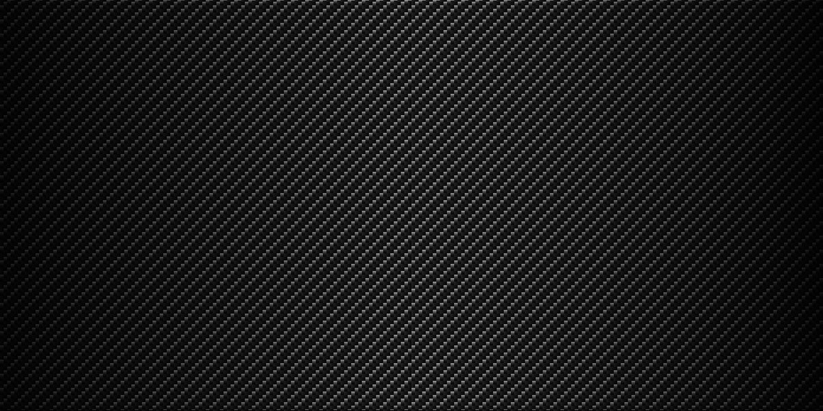 Close-up carbon fiber weave pattern highlighting the lightweight construction of the Jazzy Carbon 27X.
