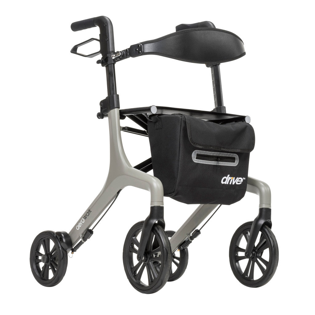 Angled view of the grey Drive AeroWalk rollator featuring a black seat, curved backrest, storage bag, and four black wheels.