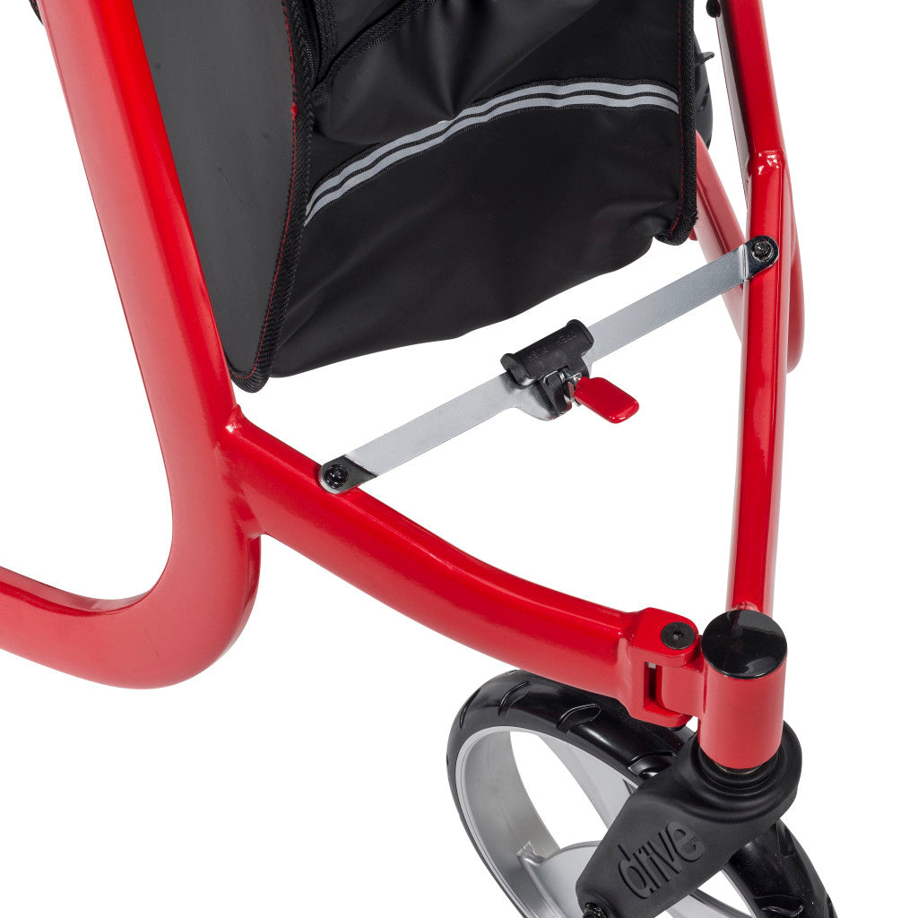 Close-up of the Drive Nitro rollator’s folding cross brace and red release tab beneath the storage bag.