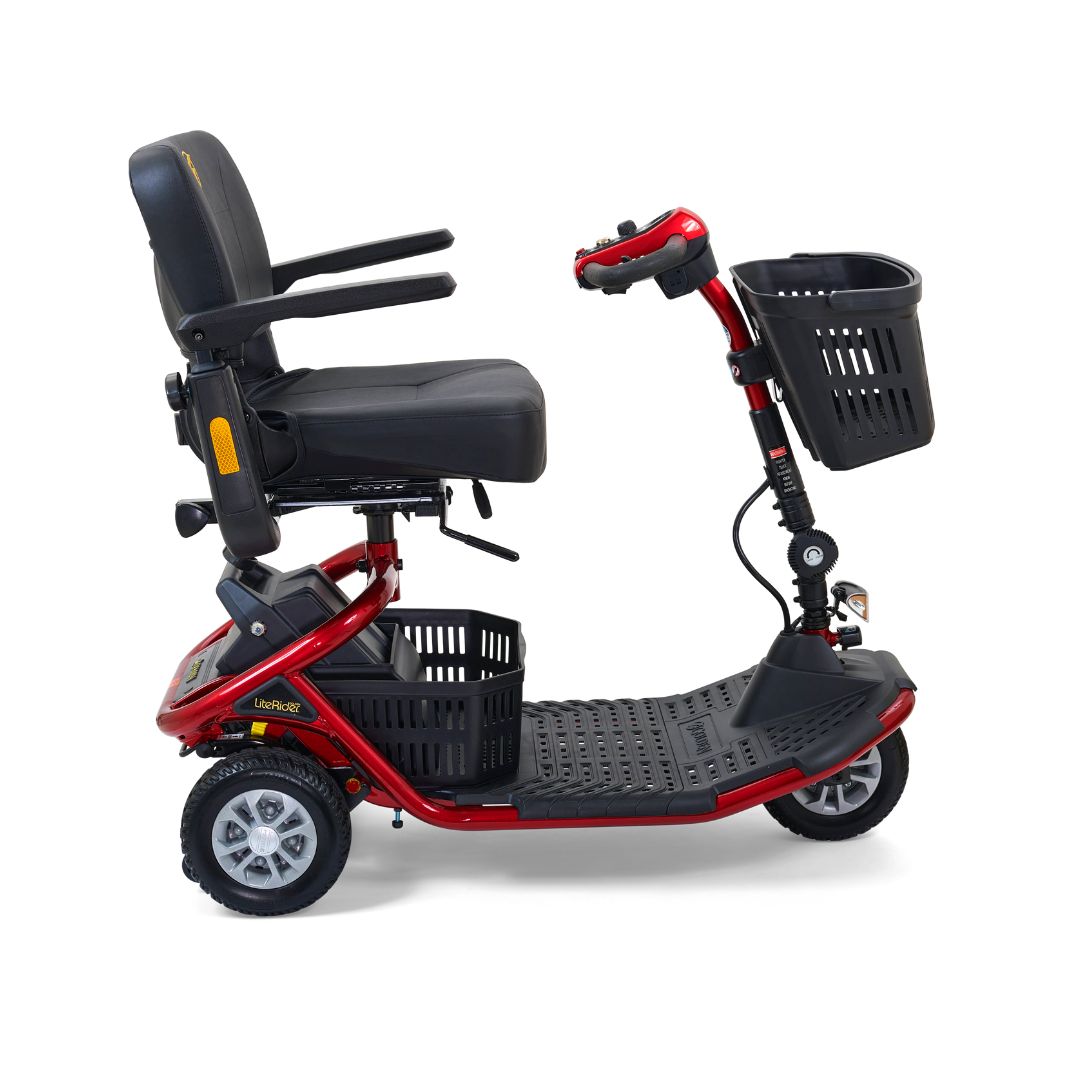 Side view of the red Golden LiteRider scooter featuring a spacious floorboard, comfortable seat, two storage baskets and compact three-wheel design.