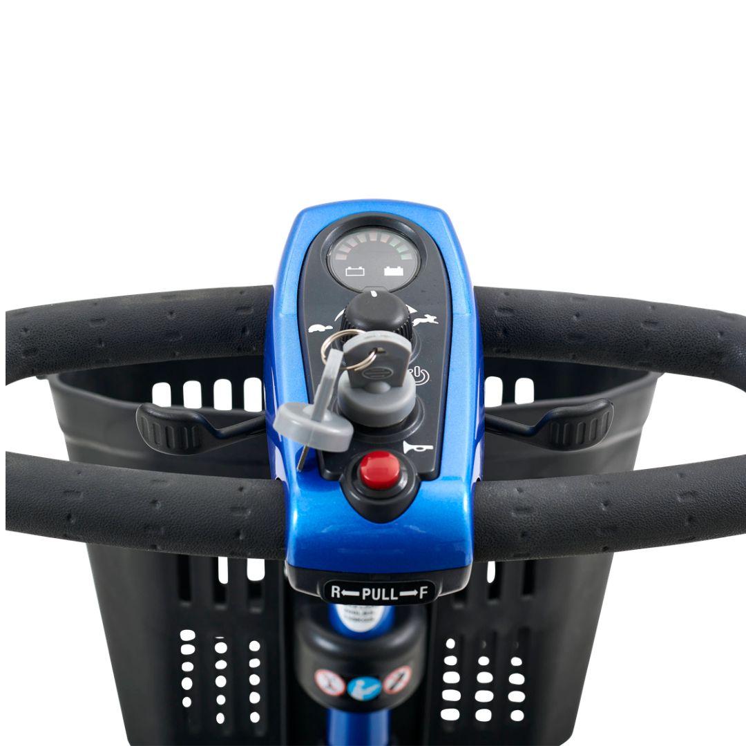 Close-up of the LiteRider’s easy-to-use controls, including the battery gauge, speed dial, key, horn and delta tiller.