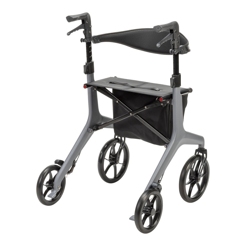 Rear angled view of the grey AeroCarbon rollator showing the seat, folding crossbars, hand brakes, and storage bag beneath the seat.