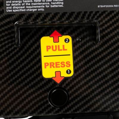 Close-up of the quick-release battery mechanism for easy battery removal and transport.