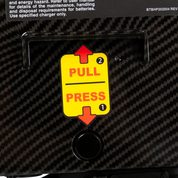 Close-up of the quick-release battery mechanism for easy battery removal and transport.