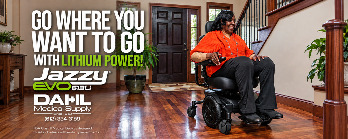 Woman in an orange sweater seated in a black Jazzy EVO 613 Li powerchair at home, beside “Go Where You Want to Go with Lithium Power!” text and the Jazzy and Dahl Medical Supply logos.