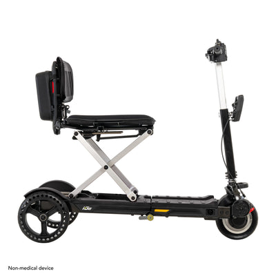 Right side view of the black and silver Pride i-Go travel scooter highlighting its compact design and sturdy wheels.
