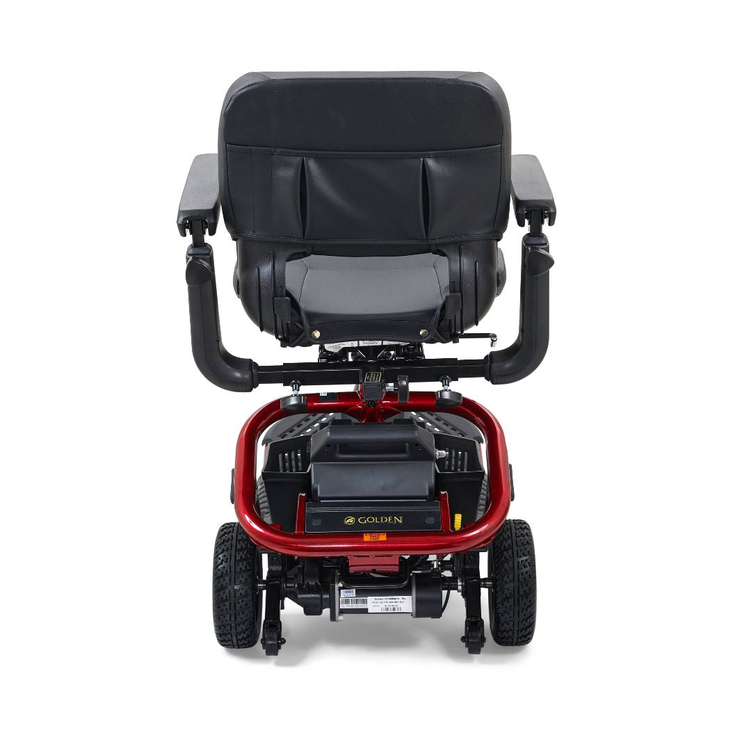 Rear view of the red Golden LiteRider scooter showing its padded seat, battery pack, sturdy frame and rear wheels.