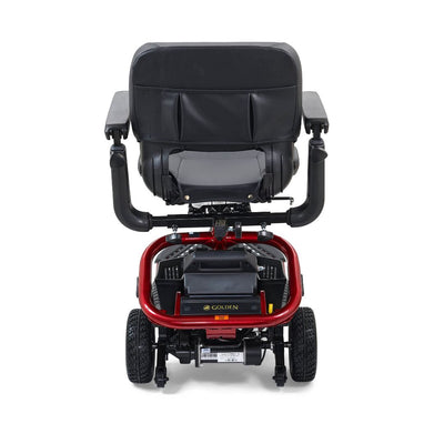 Rear view of the red Golden LiteRider scooter showing its padded seat, battery pack, sturdy frame and rear wheels.