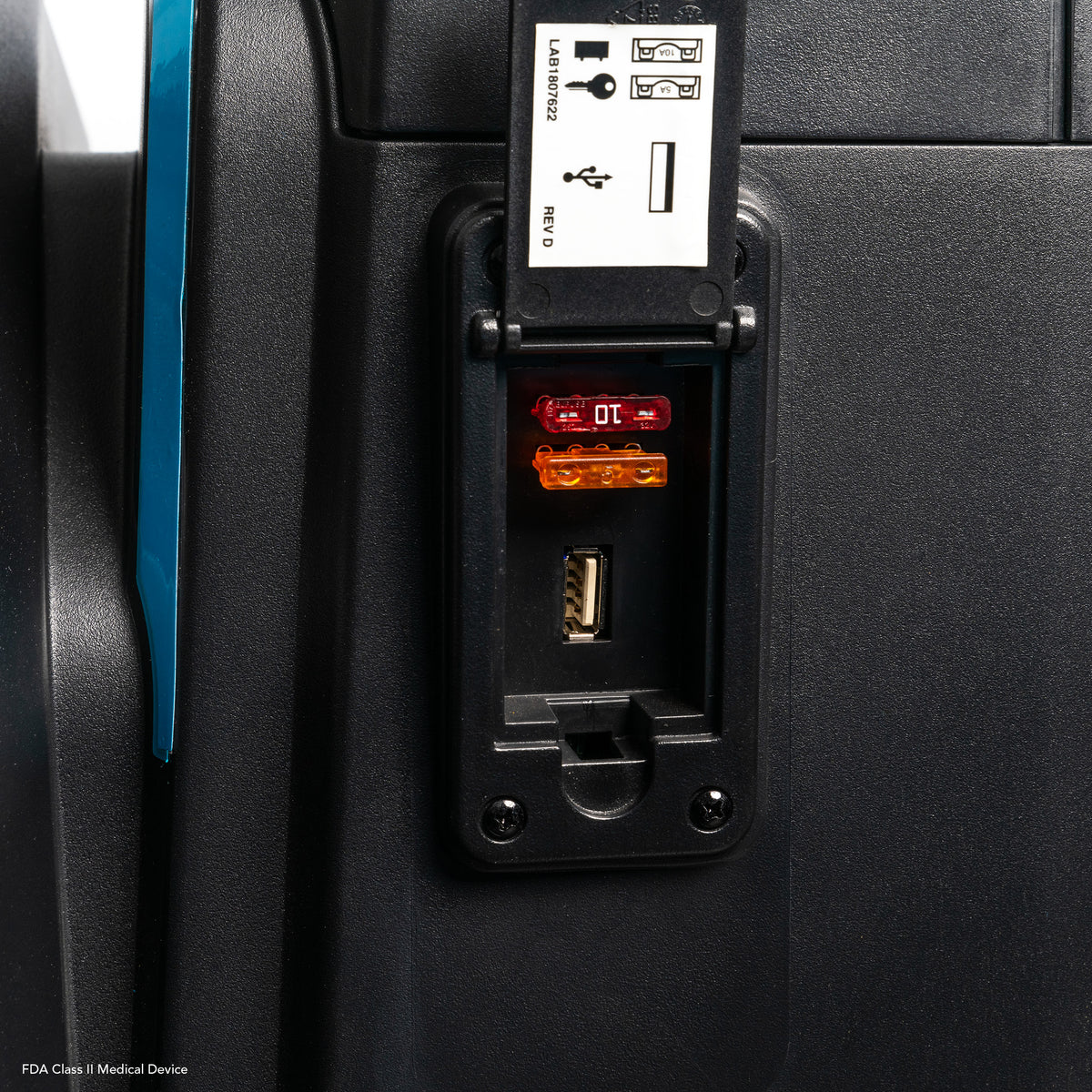 Convenient USB charging port and accessible fuse panel built into the Pride PX4 scooter.